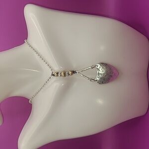Bella Uno silver tone necklace with heart pendant.